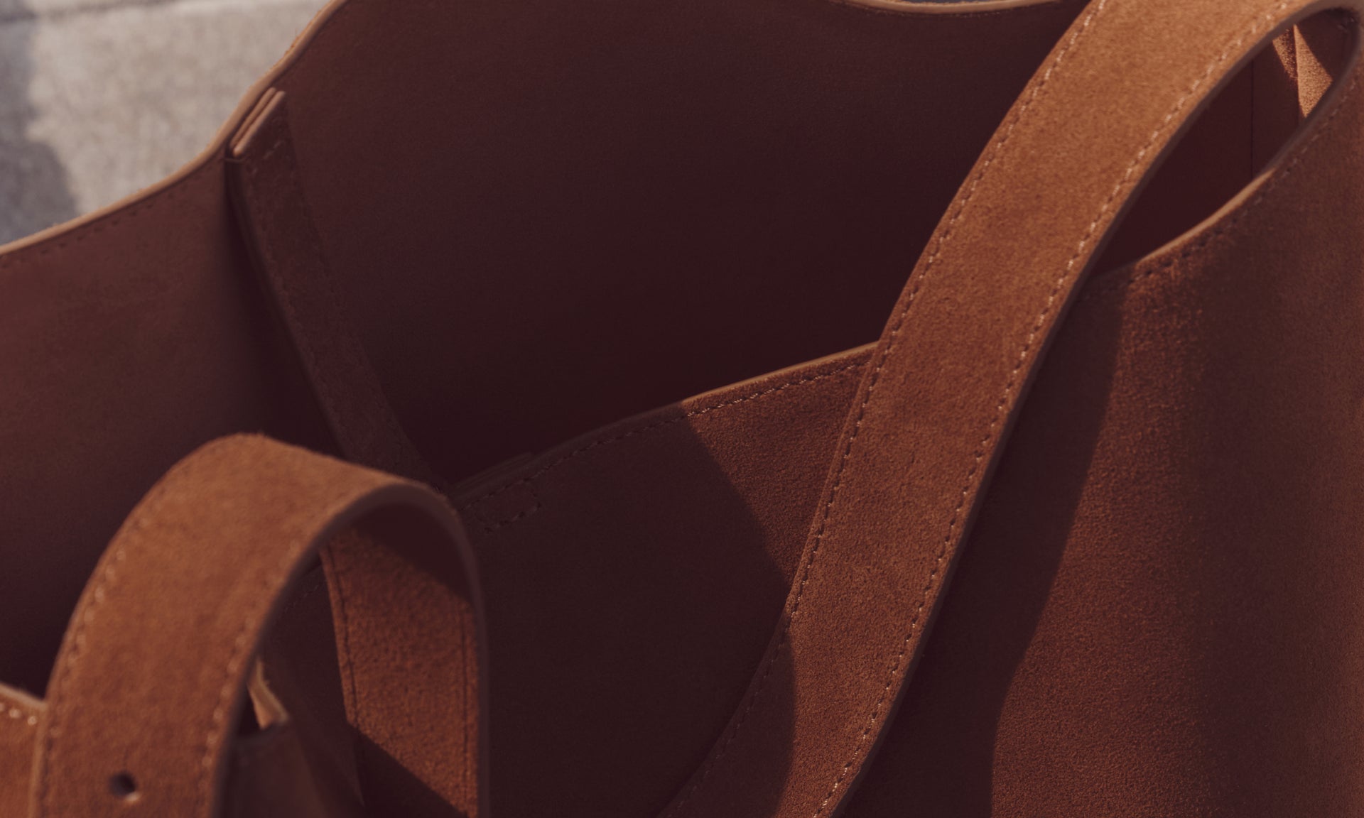 SuedeSuede is a type of leather that has been brushed or napped for a soft, supple hand and a velvety feel. Its textured surface and matte finish give it a classic, casual appeal. 